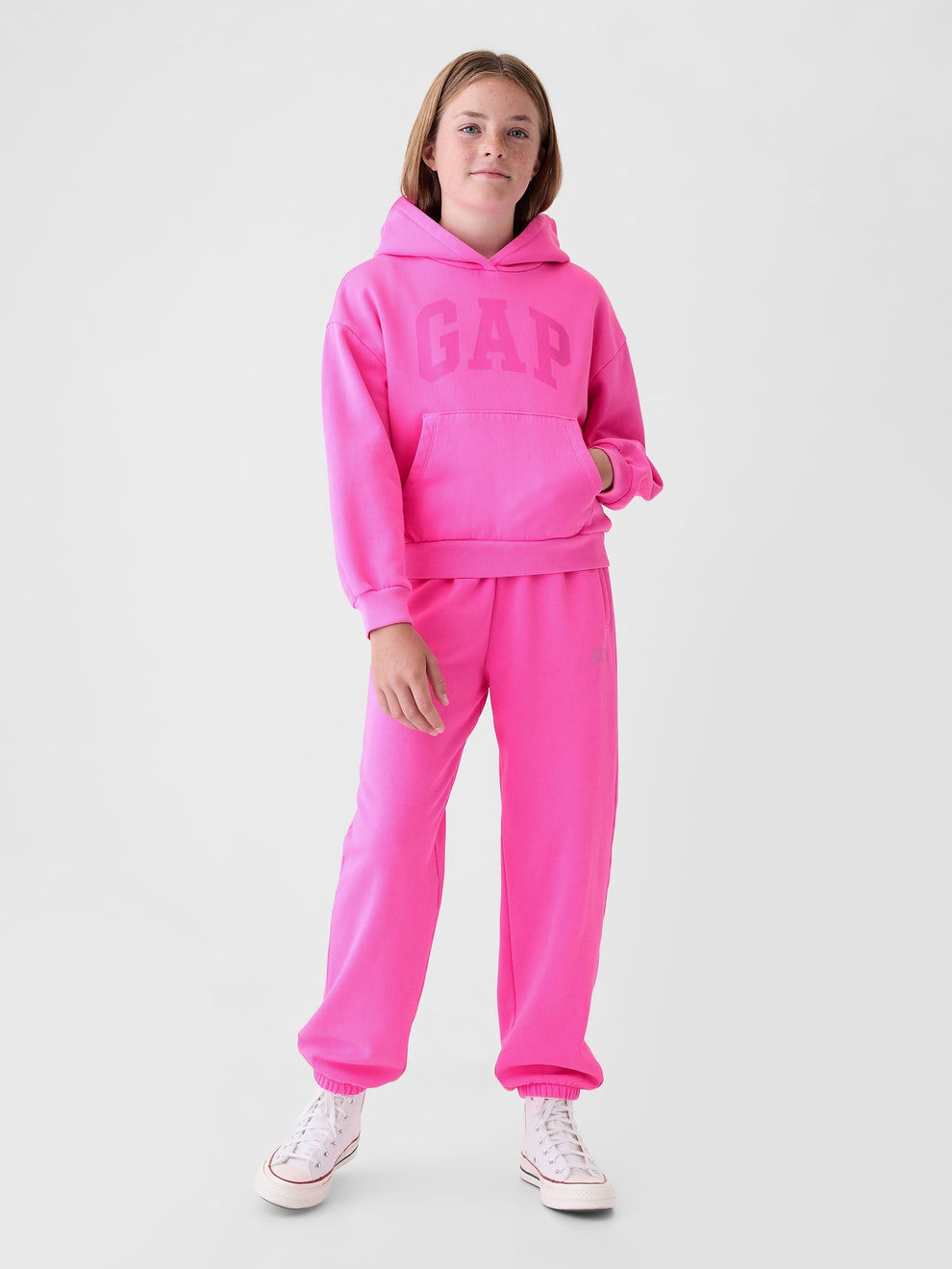 Gap Kids VintageSoft Logo Joggers in Standout pink, full-length view on a child model