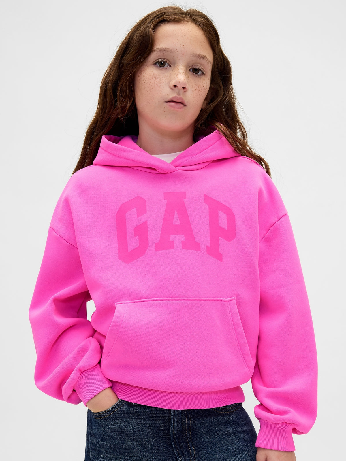 Gap Kids VintageSoft Logo Hoodie in Standout pink, front view on a child model