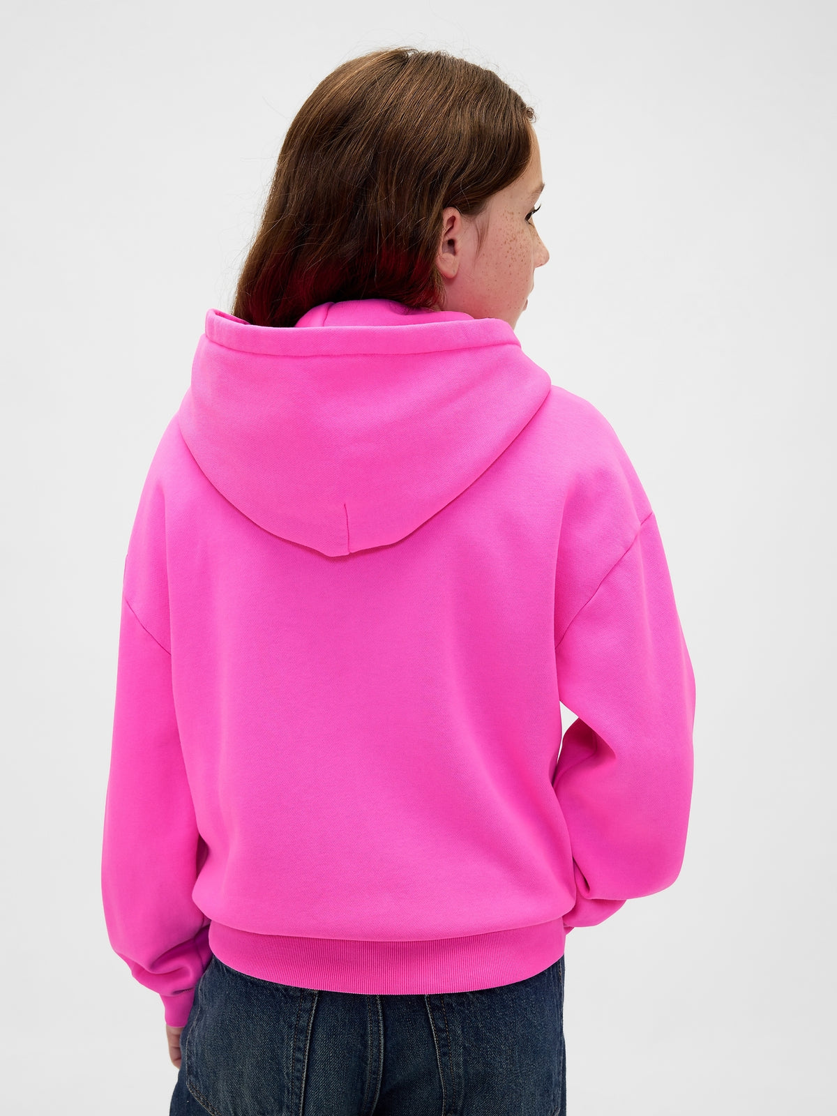 Gap Kids VintageSoft Logo Hoodie in Standout pink, back view on a child model