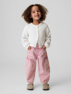 Gap Baby & Toddler Heart Pocket Horseshoe Jeans in Primitive pink, full-length view on a child model
