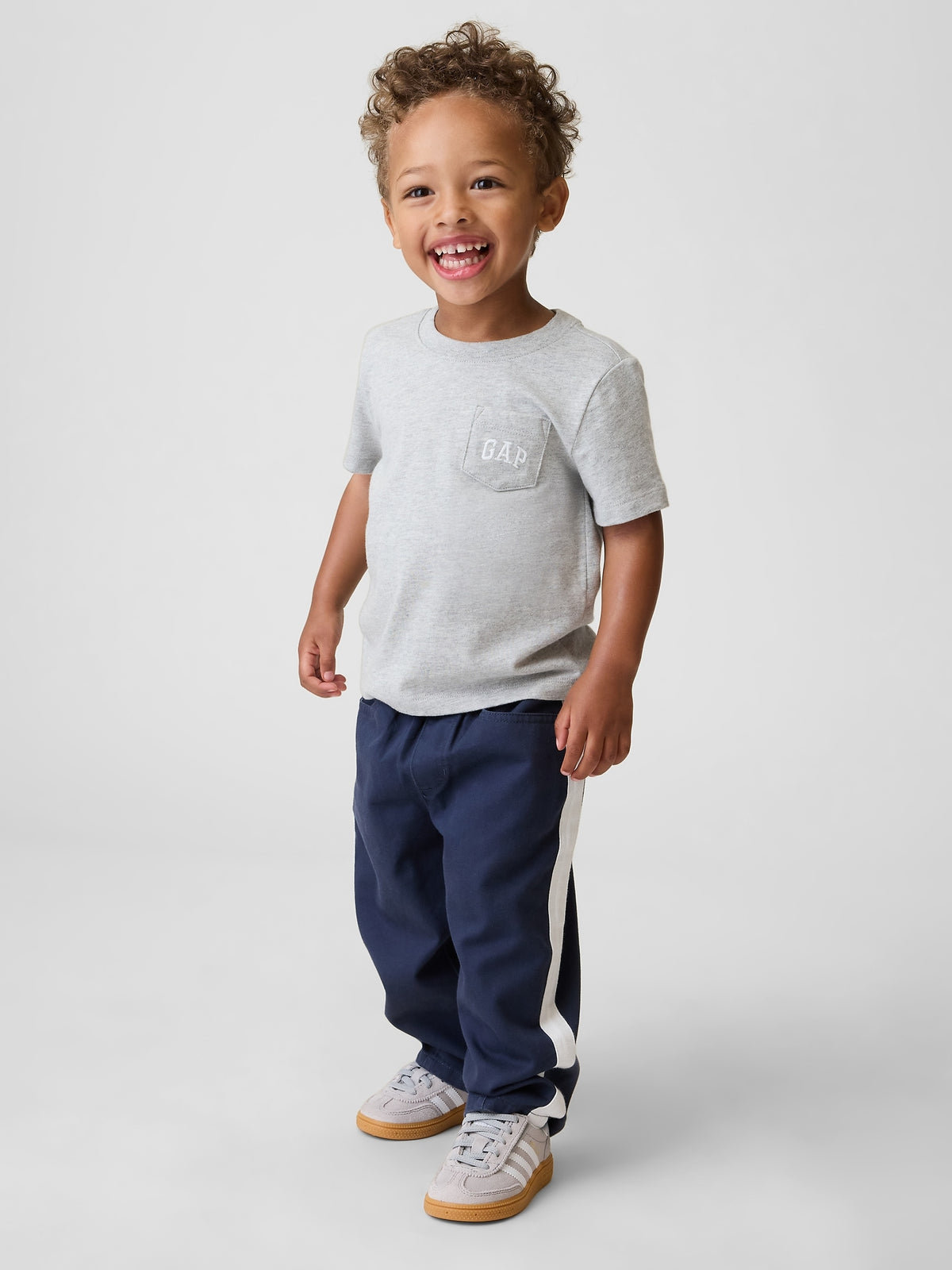 Gap Baby & Toddler UltraSoft Pull-On Stripe Barrel Pants in Vintage navy, full-length view on a child model