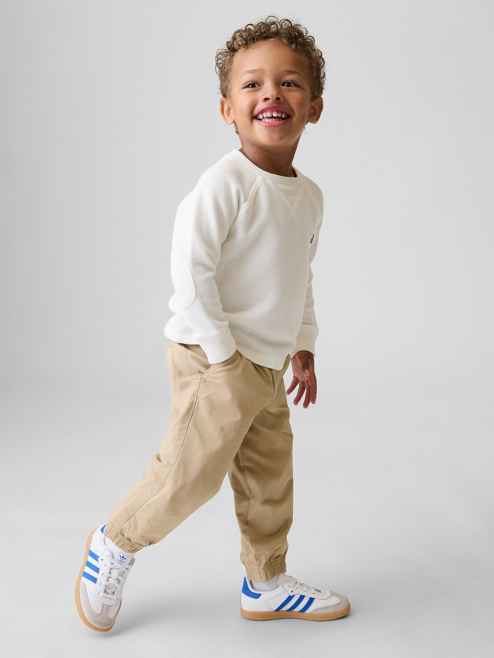 Gap Baby & Toddler Pull-On Everyday Joggers in Iconic khaki, full-length view on a child model