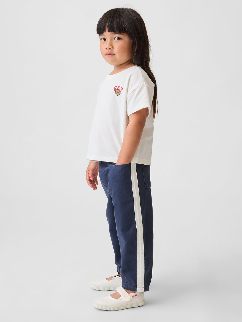 Gap Baby & Toddler UltraSoft Pull-On Stripe Barrel Pants in Vintage navy, side view on a child model