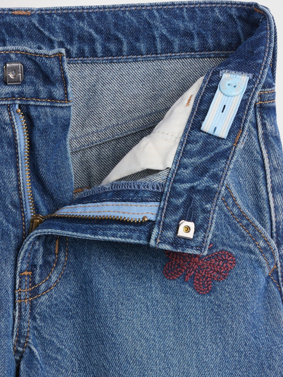 Gap Kids Low Rise Embroidered Baggy Jeans in Medium wash embroidery, button and zip detail