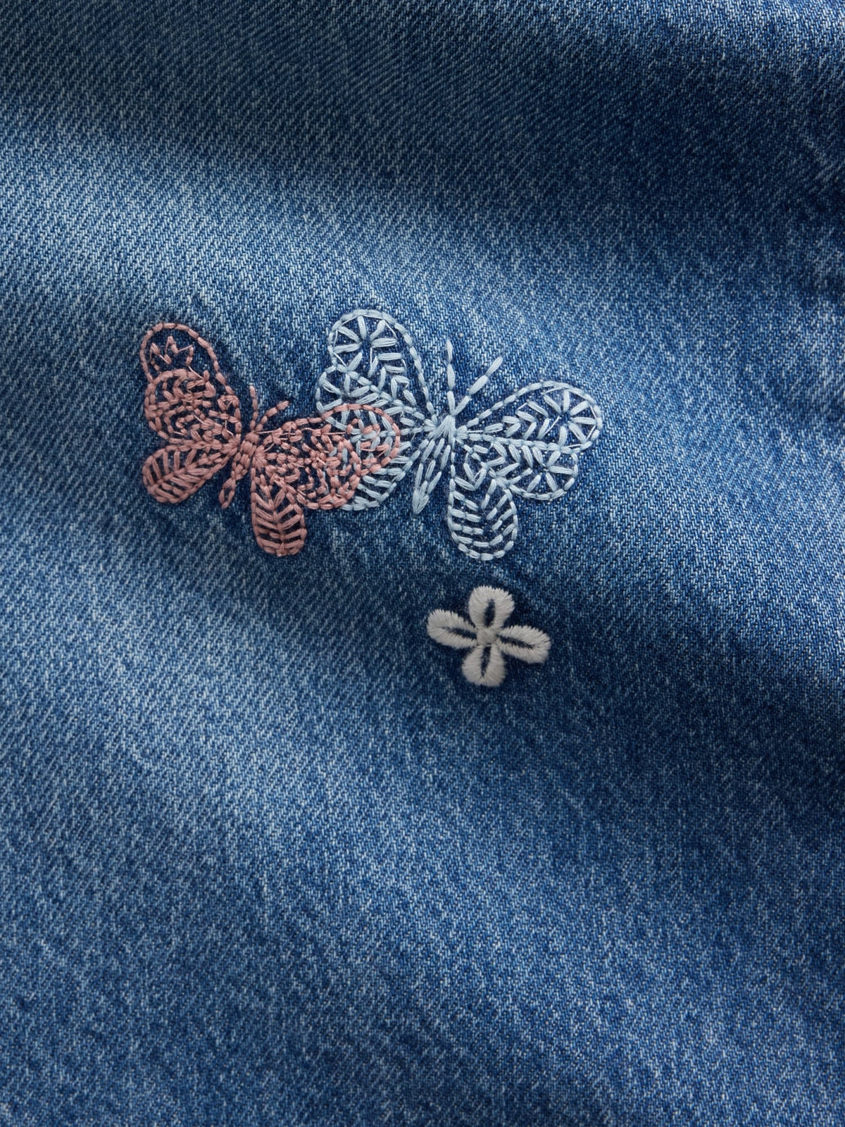 Gap Kids Low Rise Embroidered Baggy Jeans in Medium wash embroidery, butterfly and flower embroidery detail