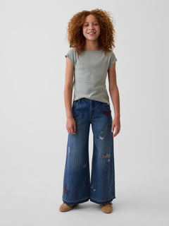 Gap Kids Low Rise Embroidered Baggy Jeans in Medium wash embroidery, full-length view on a child model