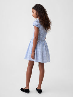 Gap Kids Smocked Print Dress in blue plaid, back view on a model
