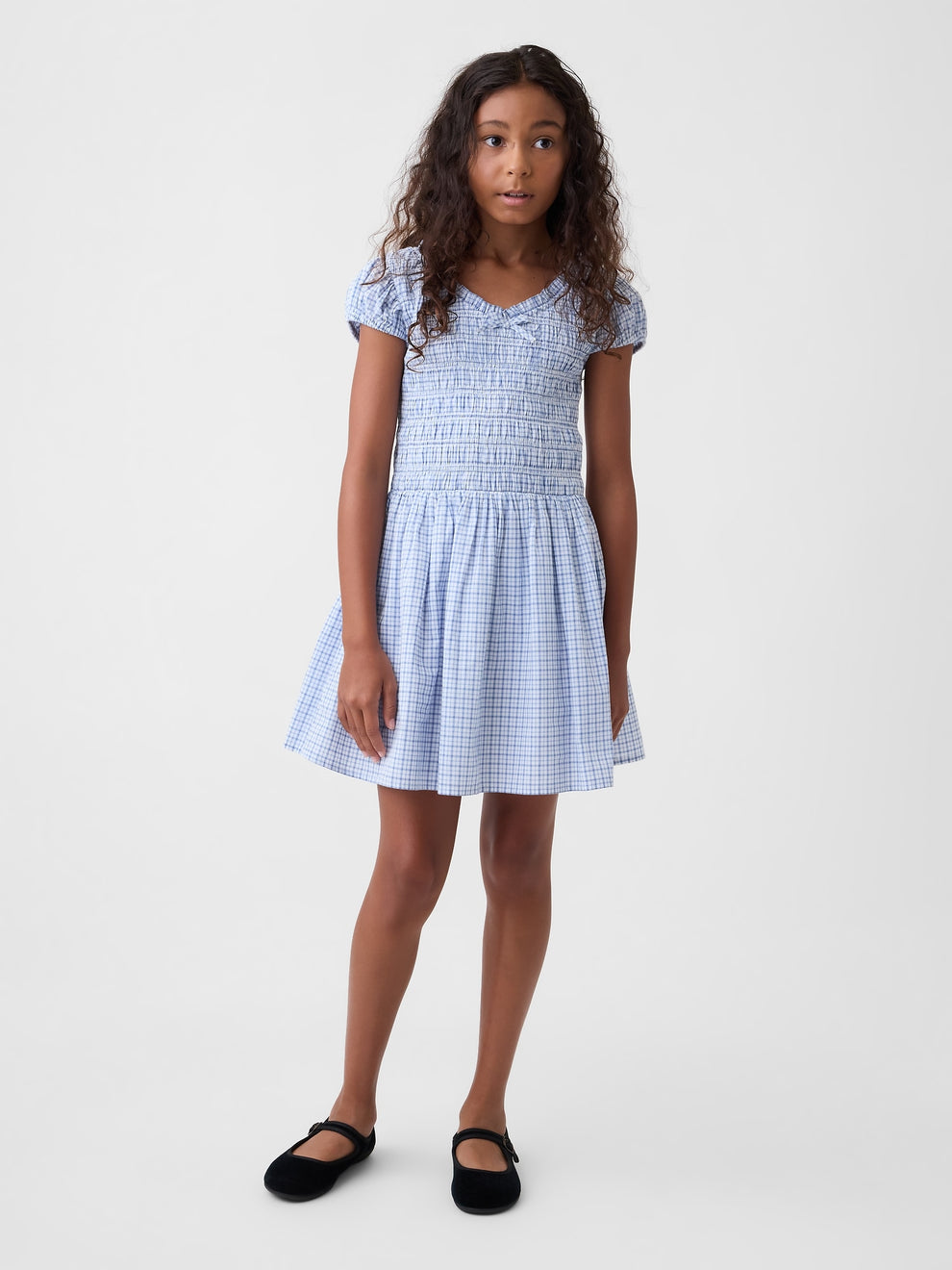 Gap Kids Smocked Print Dress in blue plaid, front view on a model