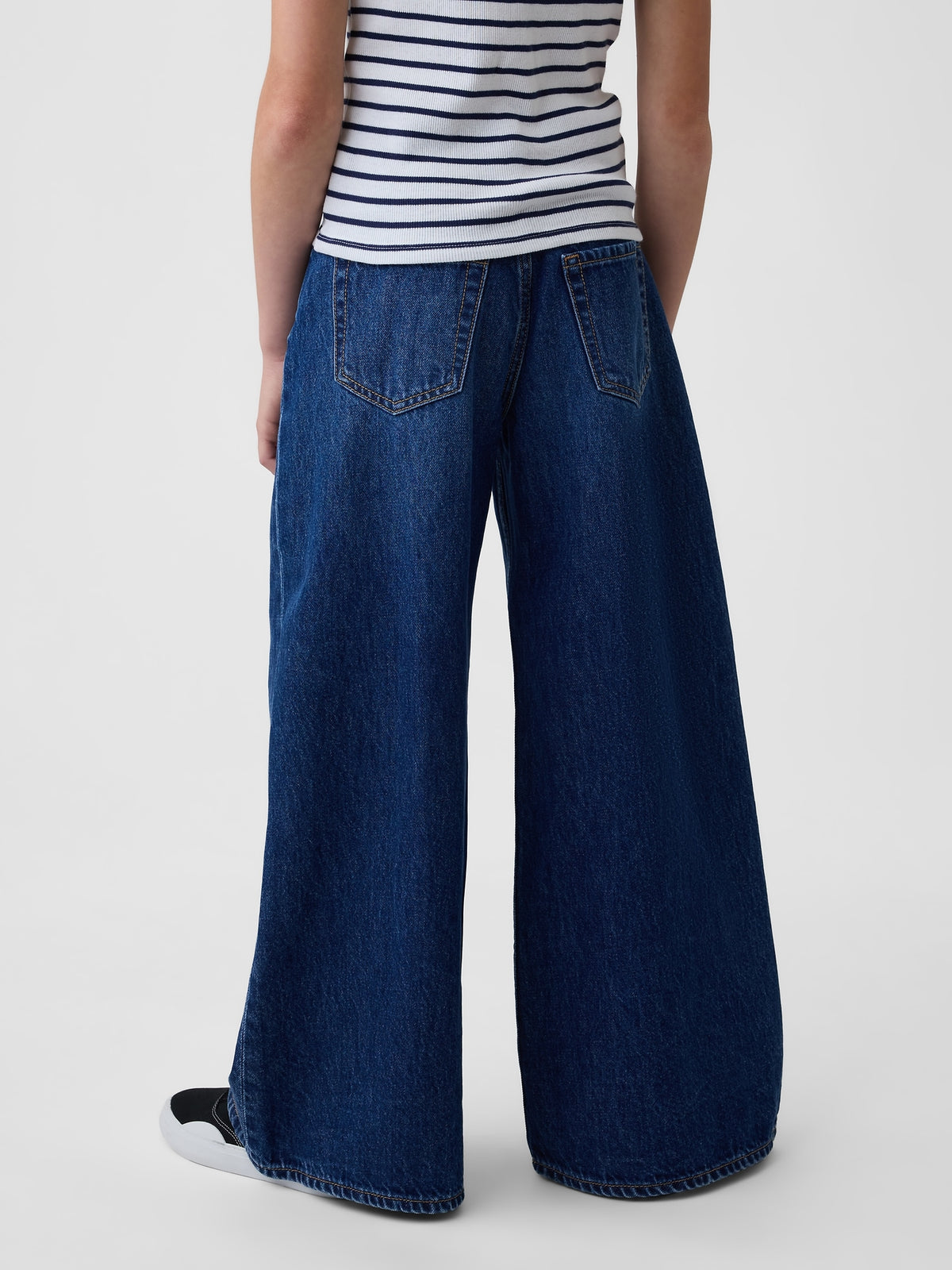 Gap Kids Low Rise Front Yoke Baggy Jeans in Dark wash, back view on a child model