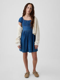 Gap Kids Denim Puff-Sleeve Dress in Medium wash, styled with a cardigan