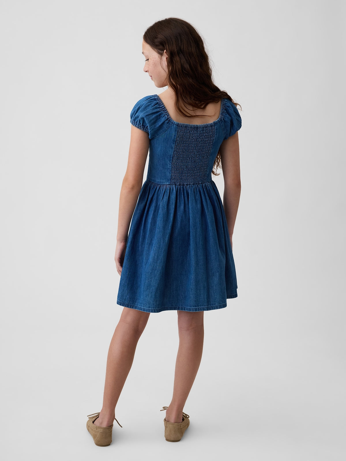 Gap Kids Denim Puff-Sleeve Dress in Medium wash, back view on a child model