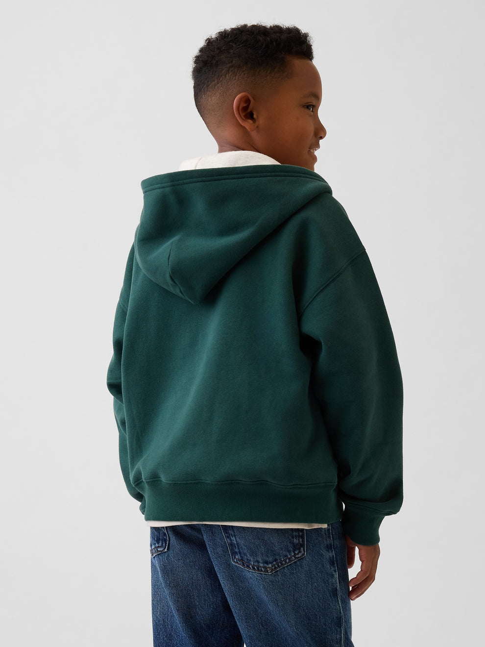 Gap Kids VintageSoft Logo Zip Hoodie in Deep hunter, back view on a child model