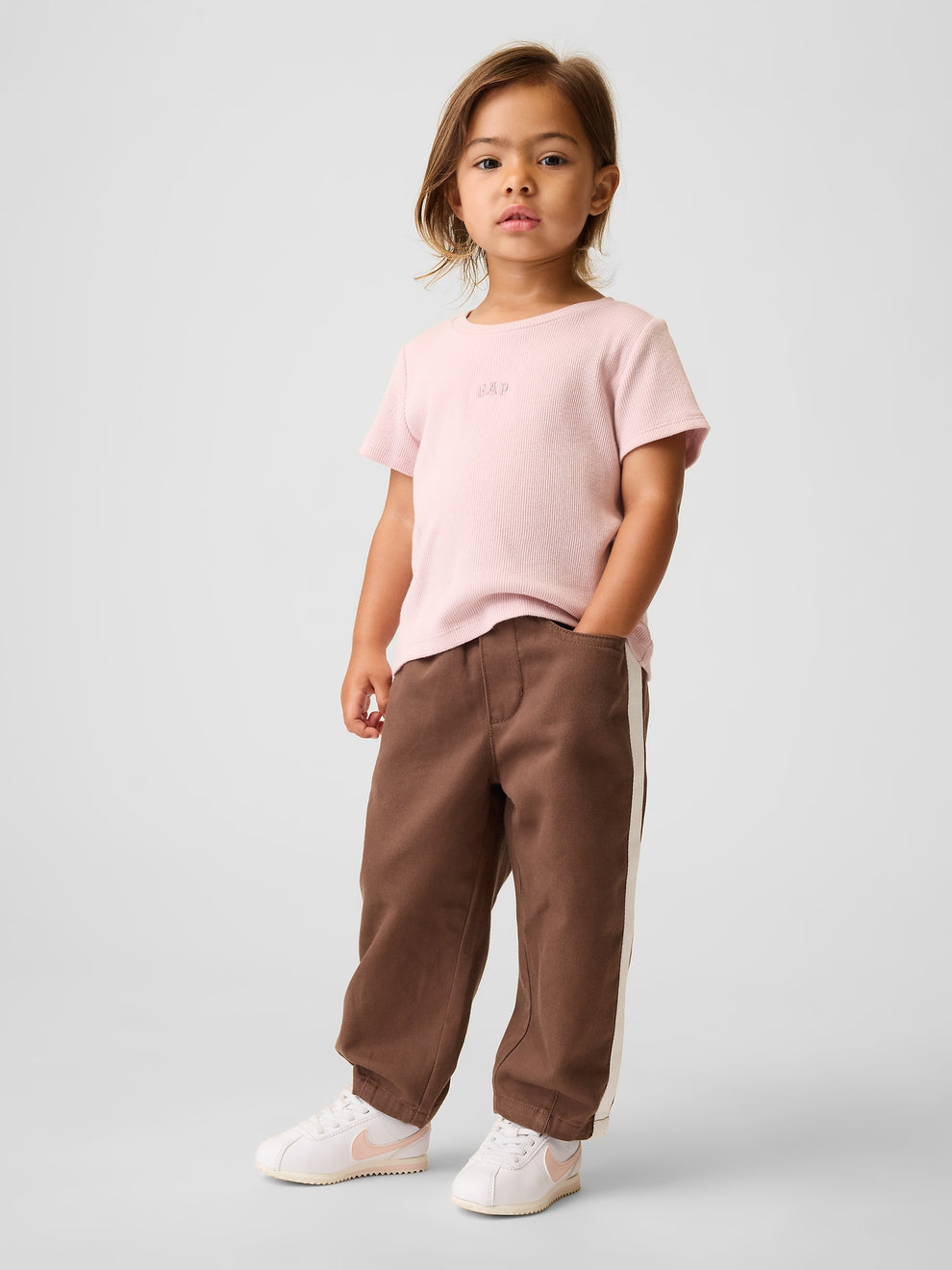 Gap Baby & Toddler UltraSoft Pull-On Stripe Barrel Pants in Amber wood, full-length view on a child model