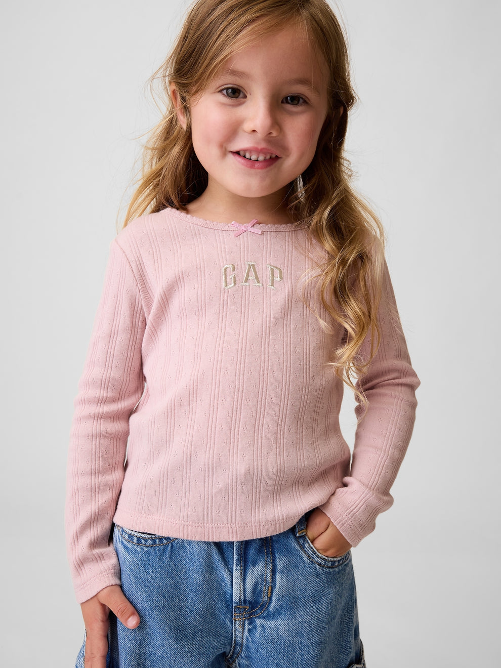 Gap Baby & Toddler Arch Logo Pointelle T-Shirt in pink, front view on a child model