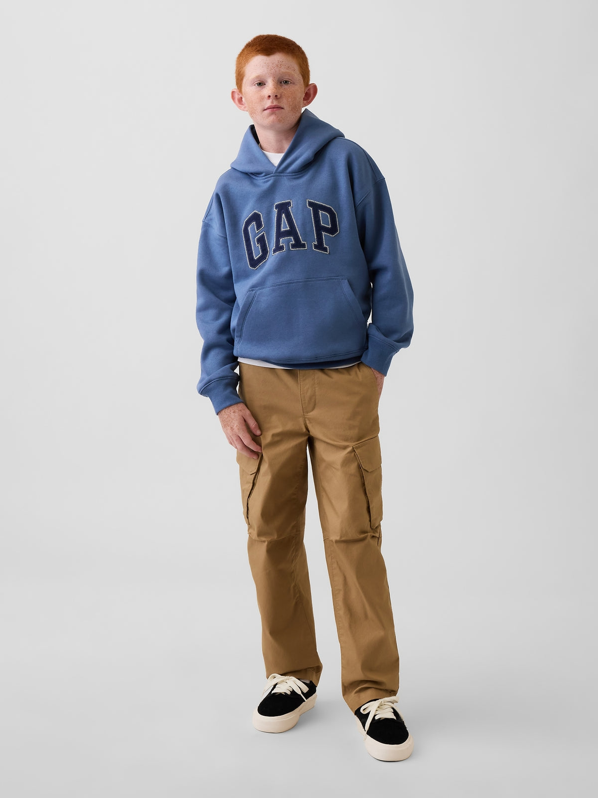 Gap Kids Quick-Dry Easy Cargo Pants in Mission tan, full-length view on a child model