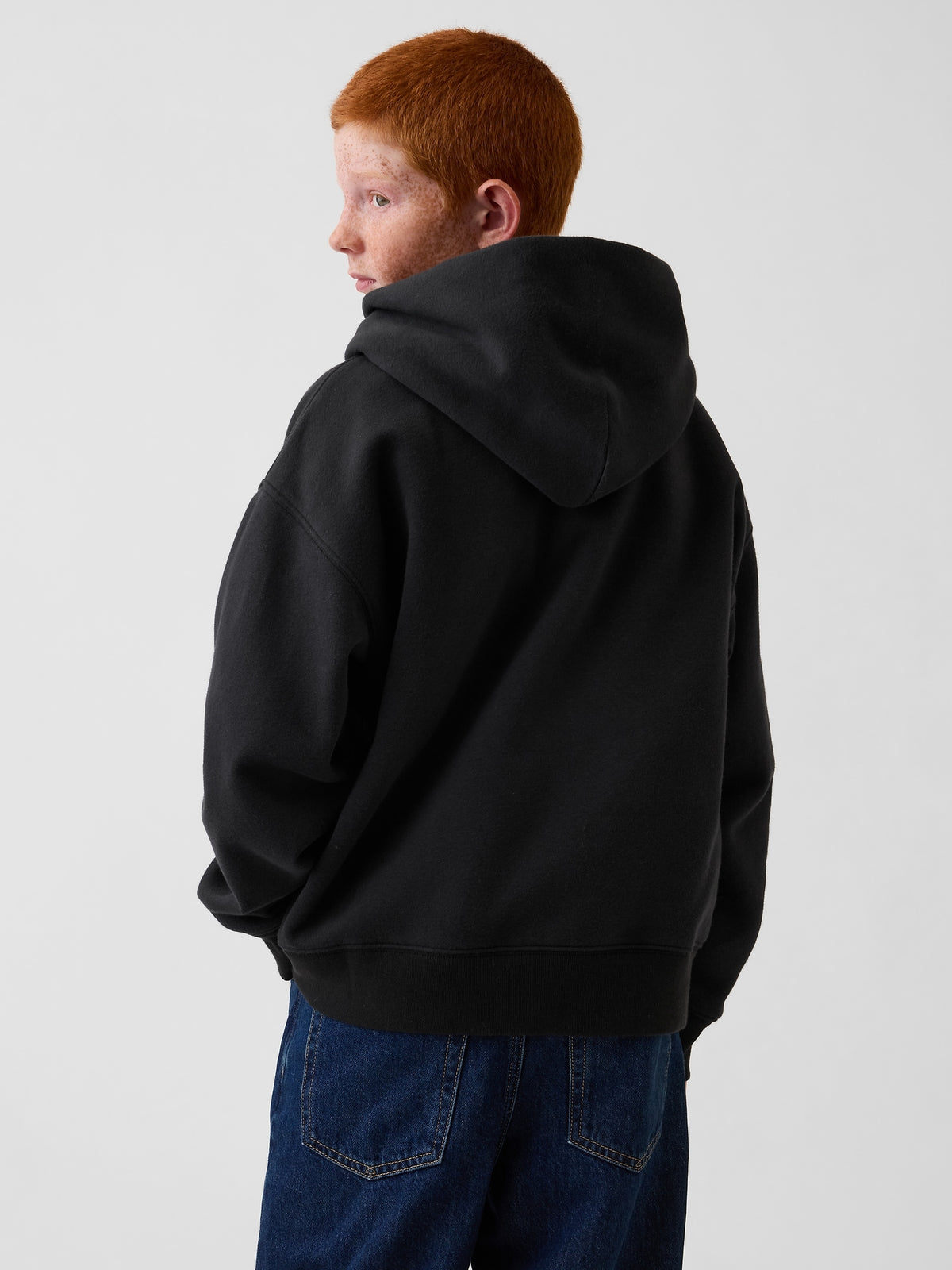 Gap Kids VintageSoft Relaxed Logo Hoodie in Moonless night, back view on a child model