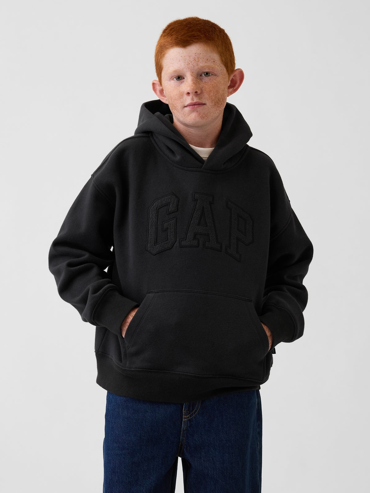 Gap Kids VintageSoft Relaxed Logo Hoodie in Moonless night, front view on a child model
