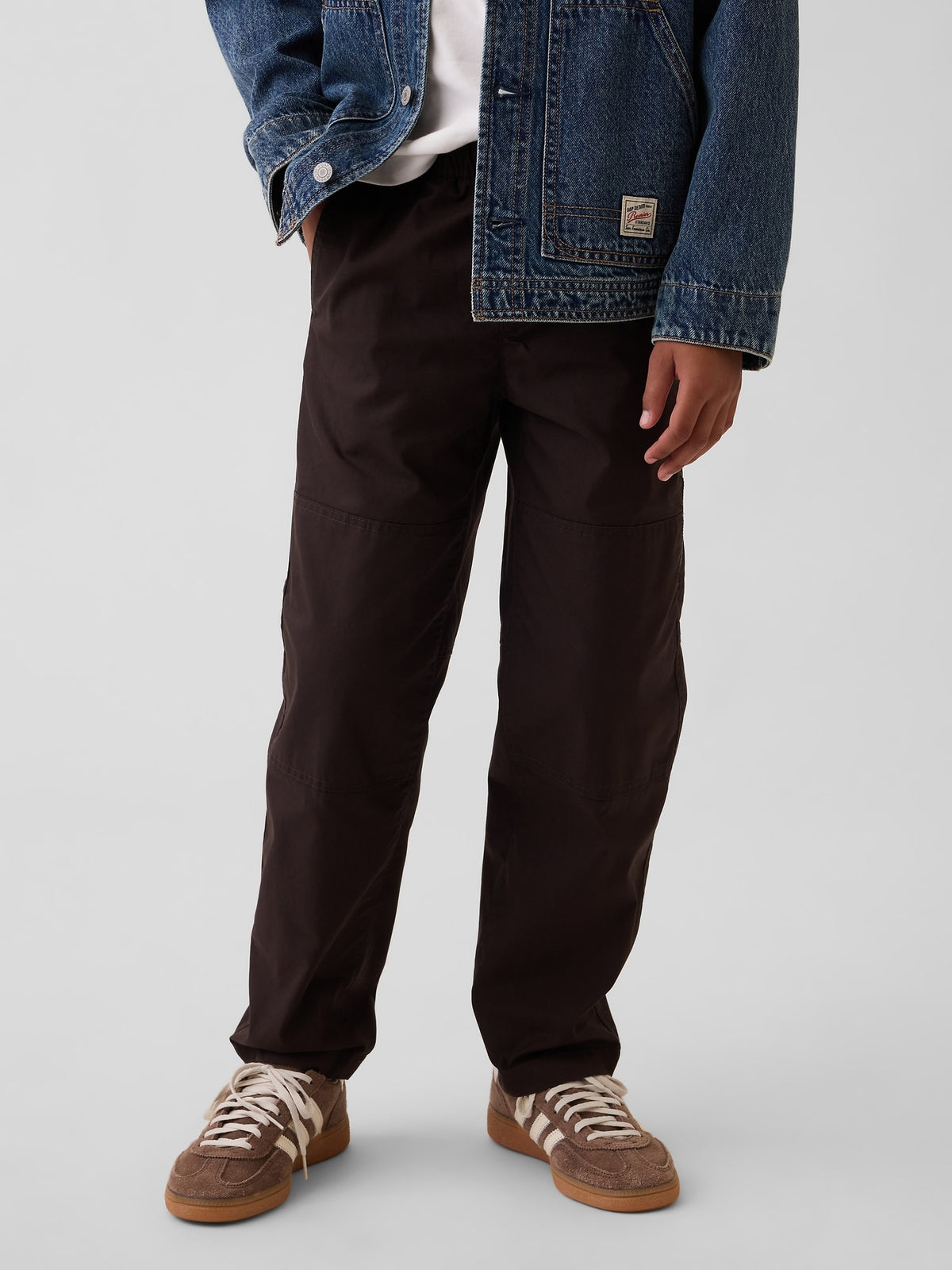 Gap Kids Double-Knee Quick-Dry Pants in Terra brown, front view on a child model