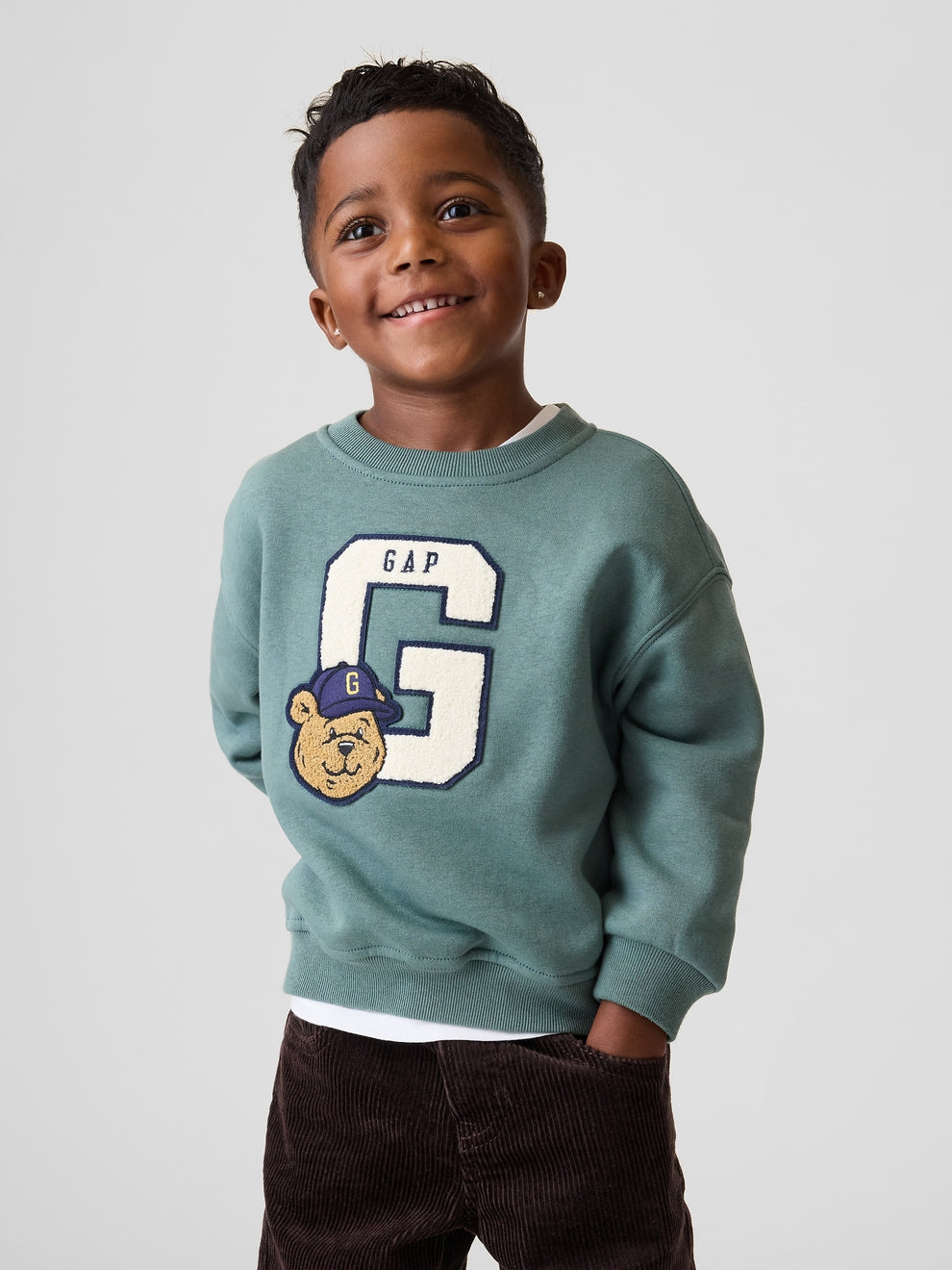 Gap Baby & Toddler VintageSoft Varsity Logo Sweatshirt in district green, front view on a child model