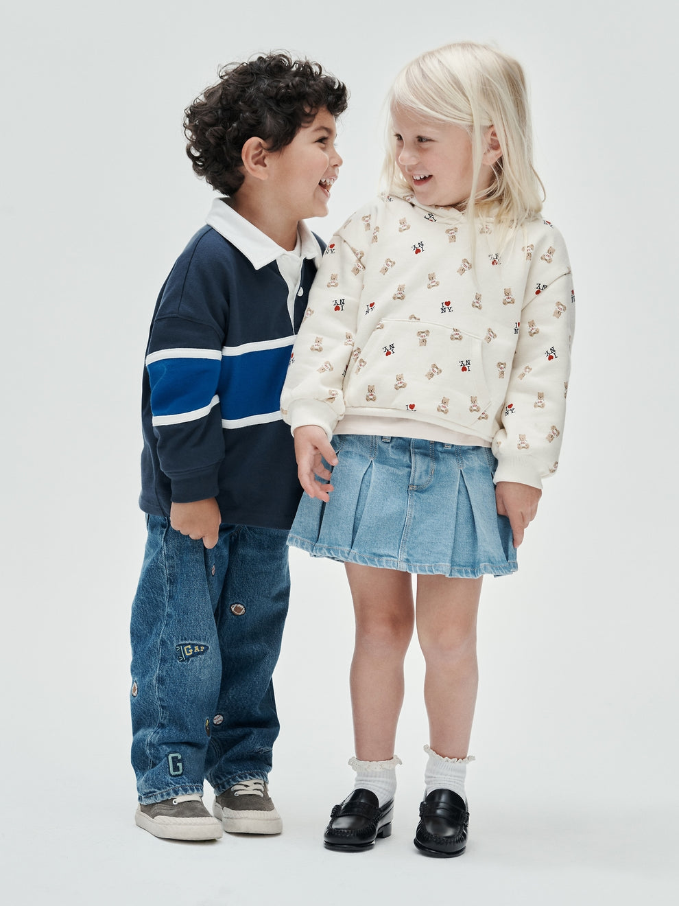Gap Baby & Toddler Denim Pleated Skort in Light wash, full-length view on a child model