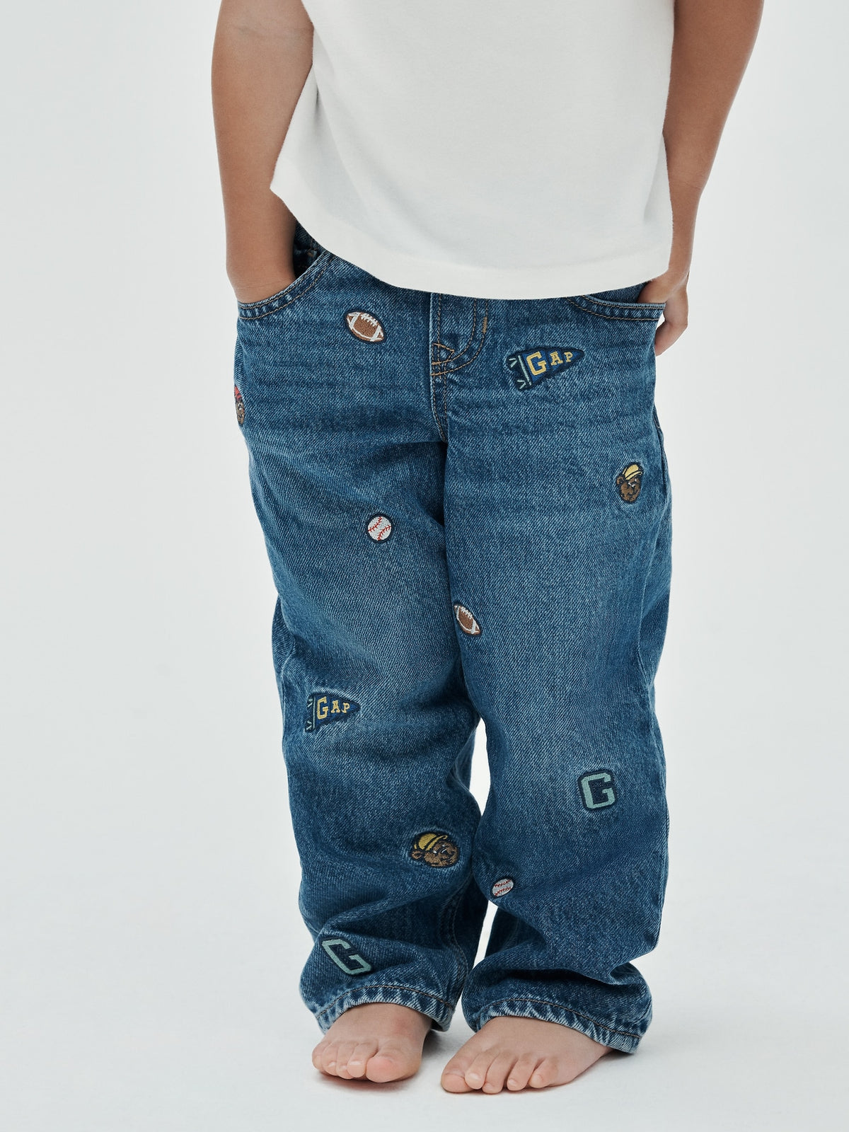 Gap Baby & Toddler Embroidered Pull-On Baggy Jeans in Medium wash embroidered, front view on a child model