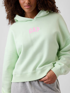 Relaxed Gap Mini-Logo Cropped Hoodie in Pod green, logo detail on a model
