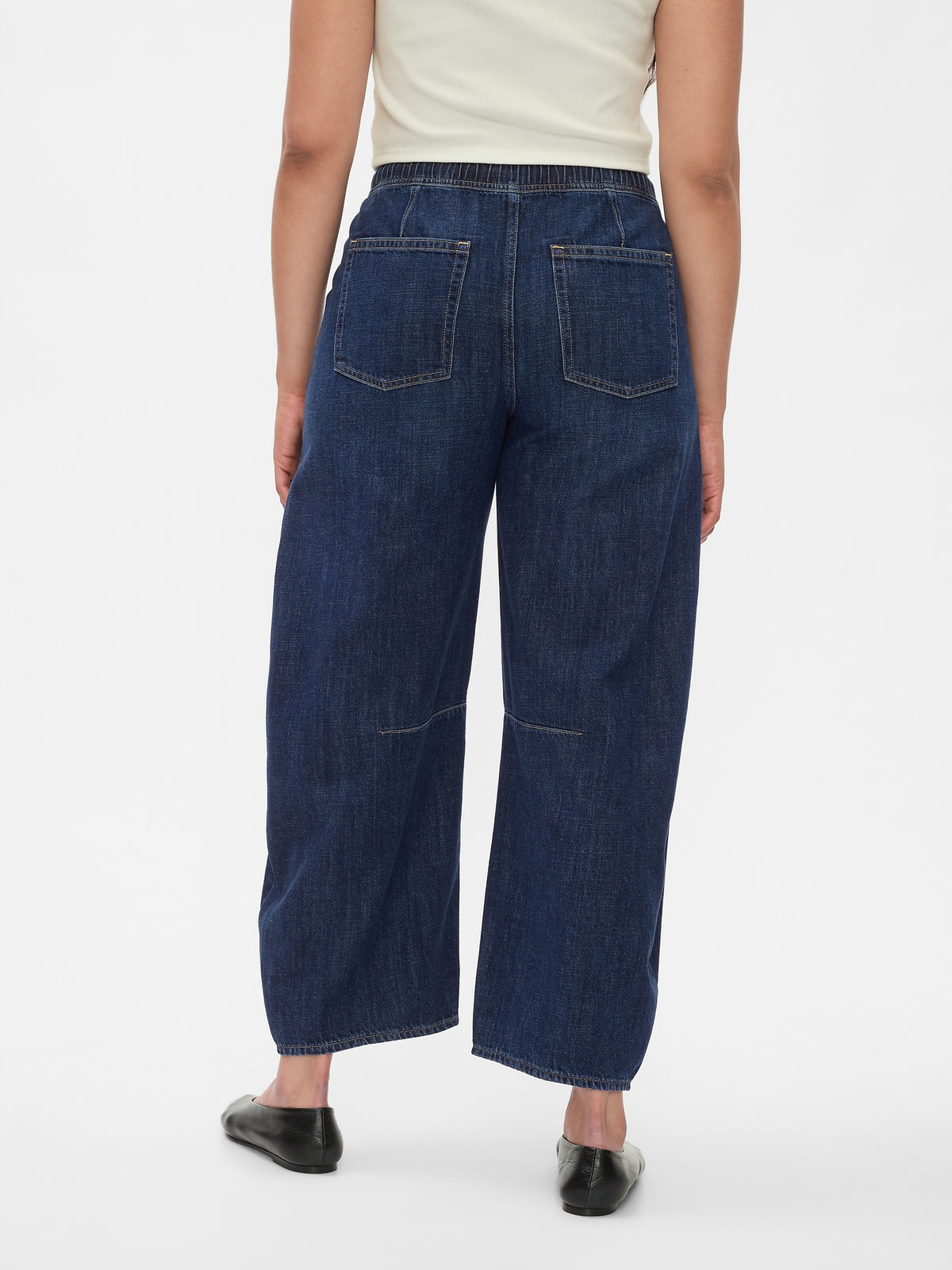 Gap Mid Rise Easy Horseshoe Jeans in Dark indigo, back view on a model