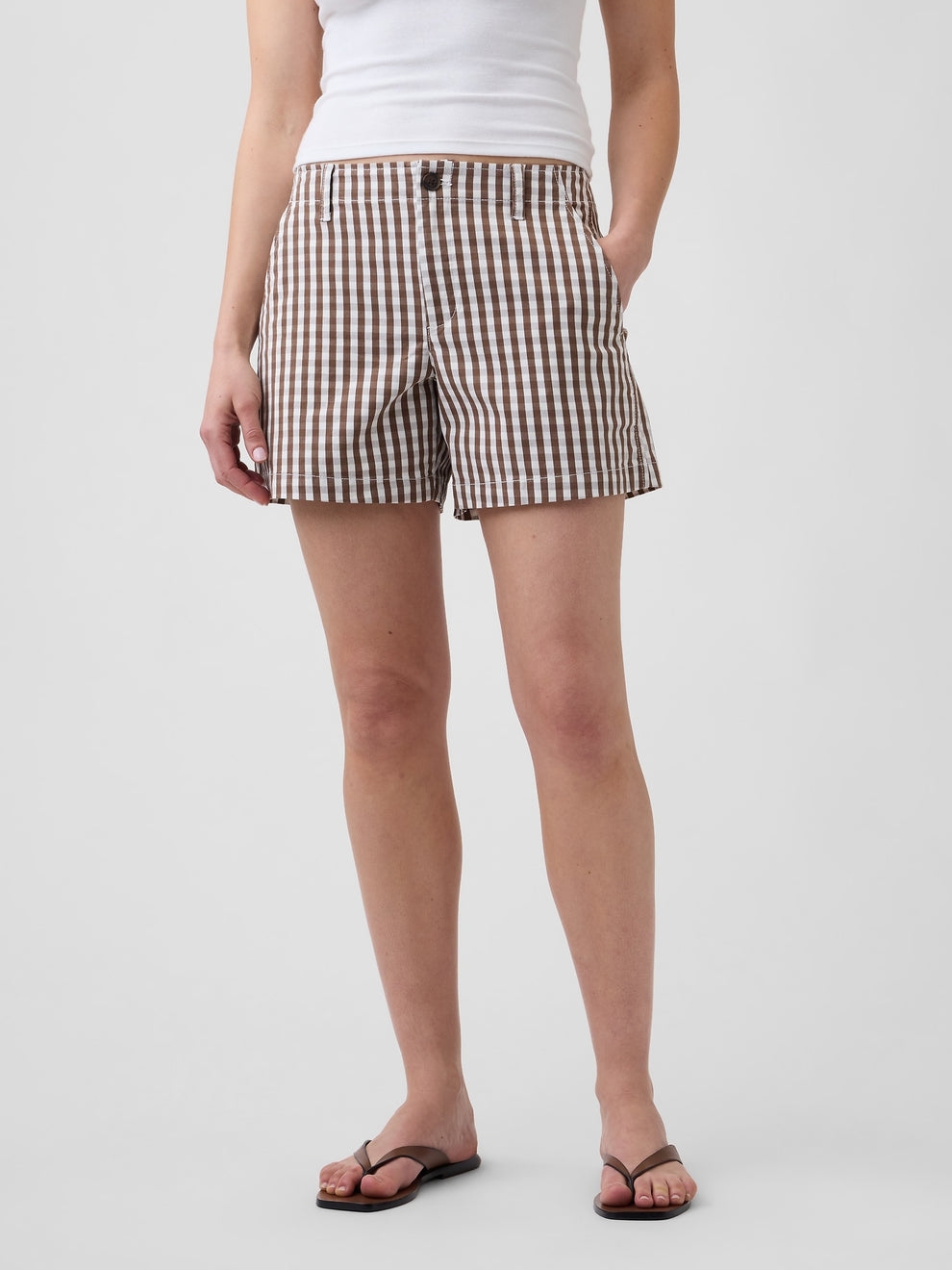 Gap 5" Mid Rise Downtown Khaki Shorts in Brown gingham, front view on a model