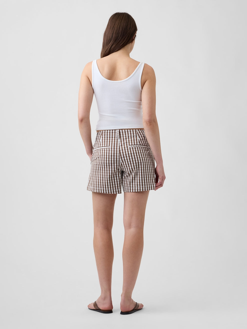 Gap 5" Mid Rise Downtown Khaki Shorts in Brown gingham, back view on a model