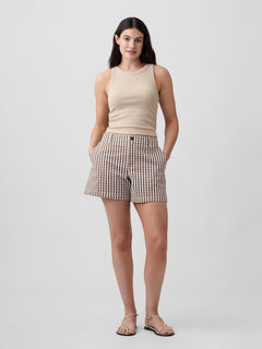 Gap 5" Mid Rise Downtown Khaki Shorts in Brown gingham, full-length view on a model