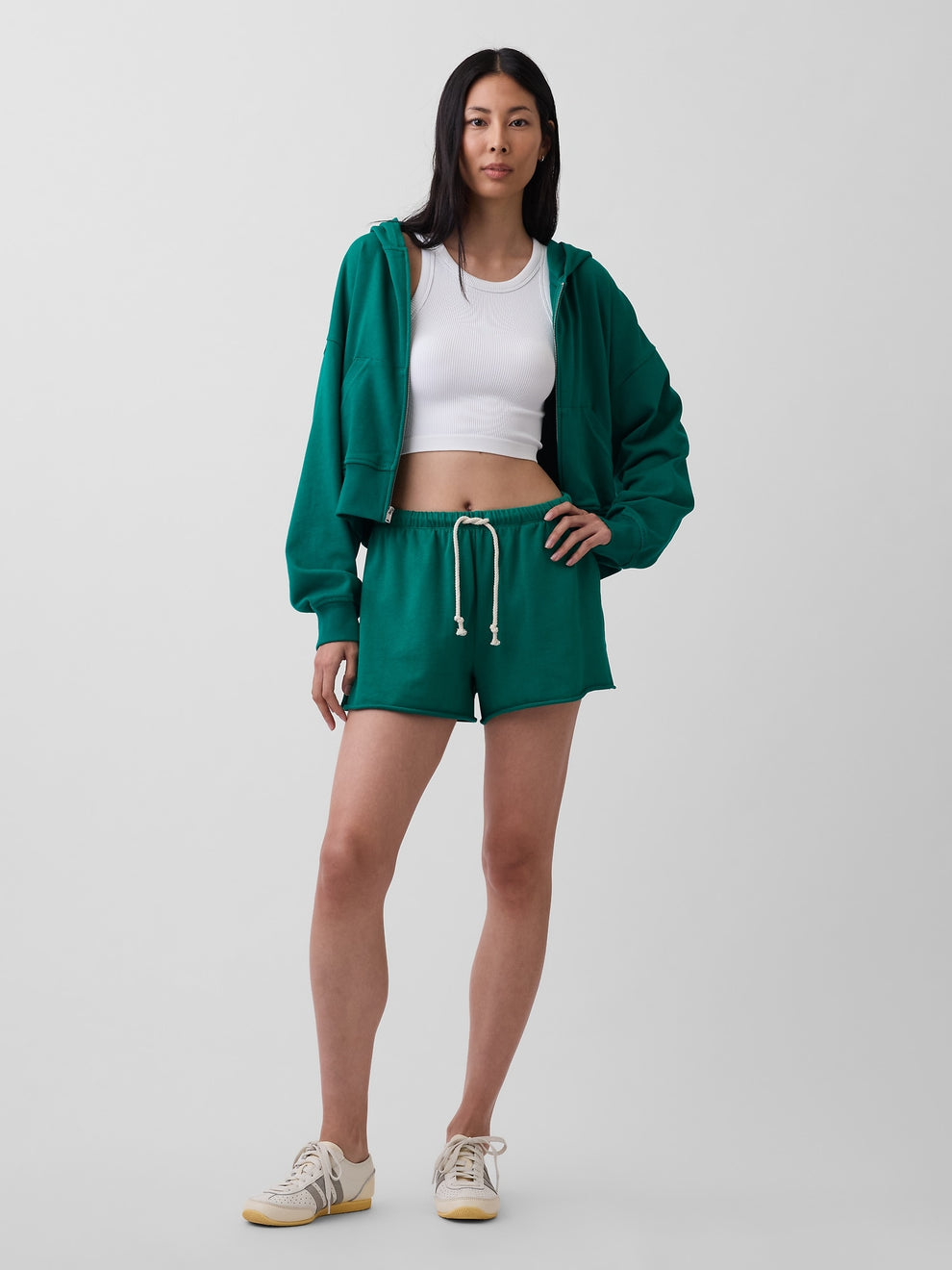 Gap 3.5" VintageSoft Terry Relaxed Sweat Shorts in Baize green, full-length view on a model