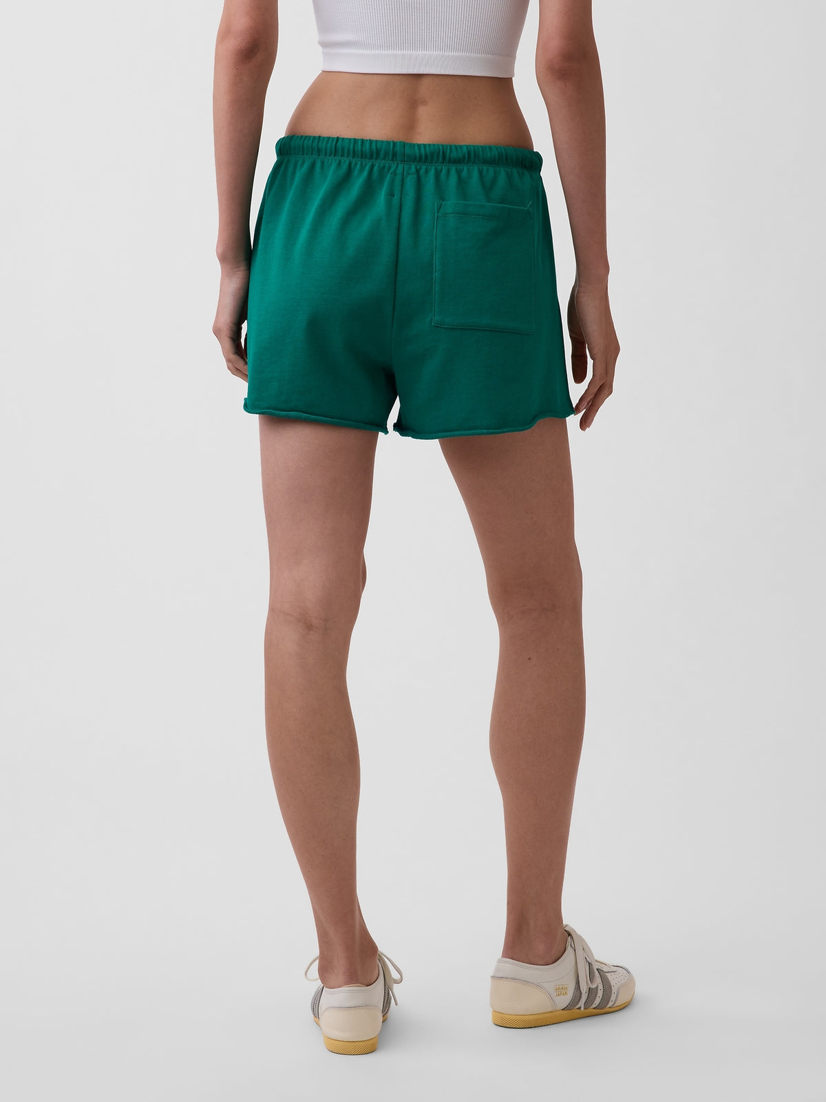 Gap 3.5" VintageSoft Terry Relaxed Sweat Shorts in Baize green, back view on a model