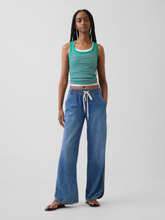Gap Low Rise UltraSoft '90s Loose Easy Dolphin-Hem Jeans in Medium indigo, full-length view on a model