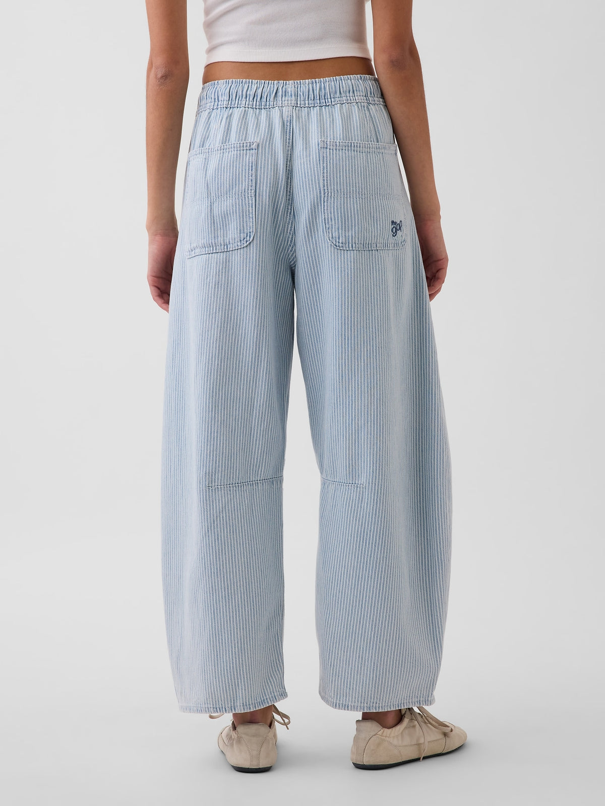 Gap UltraSoft Horseshoe Jeans in blue railroad stripe, back view on a model