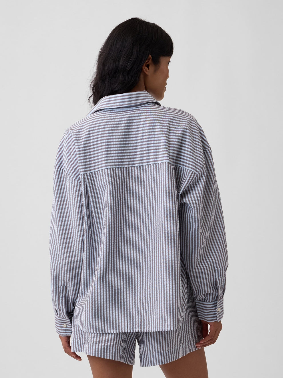 Oversized Shirt in Seersucker in Navy Stripe - back view on model