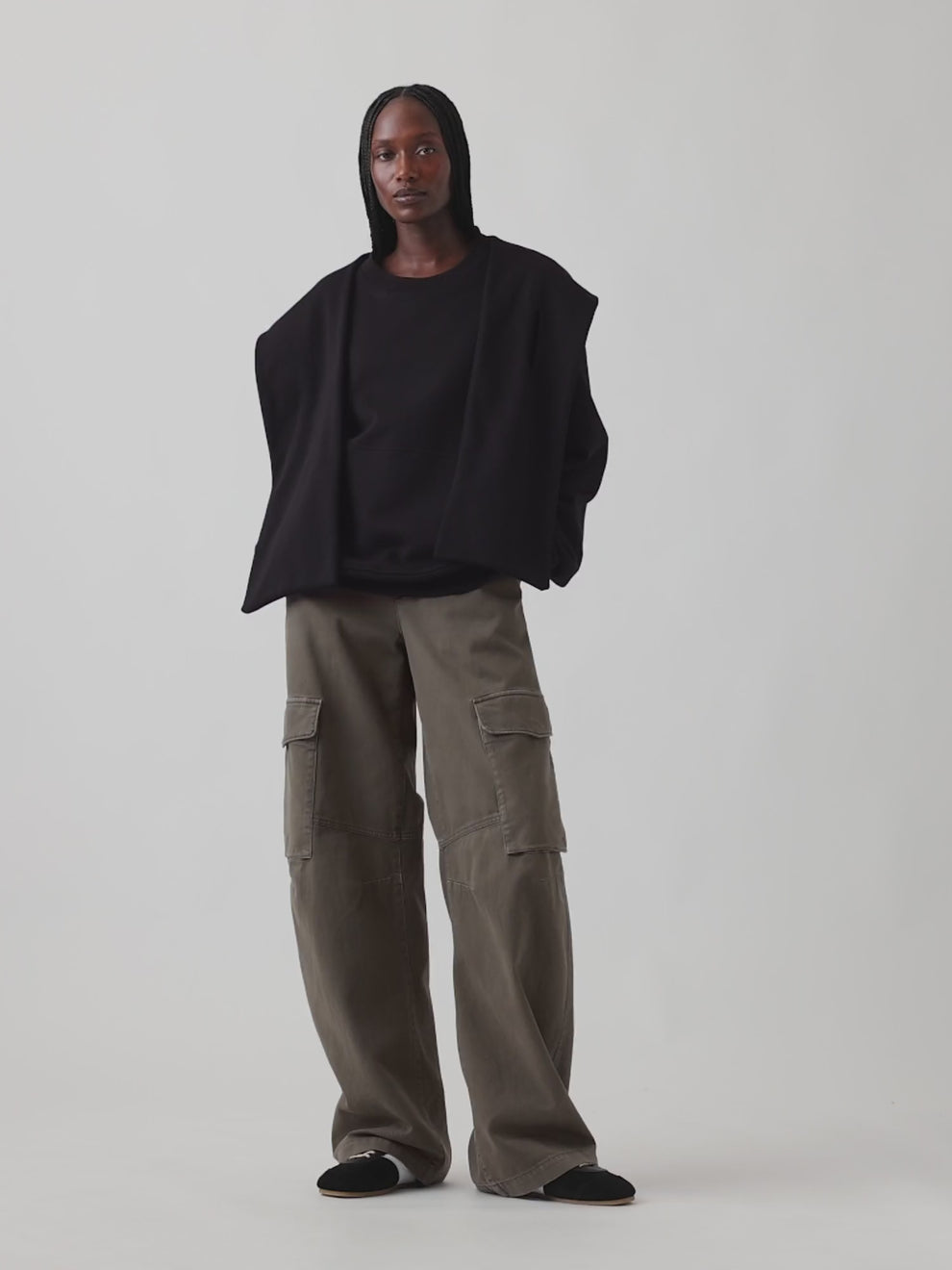 Black VintageSoft oversized scarf hoodie shown in motion